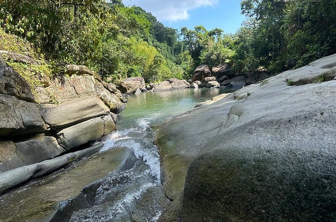 El Yunque & Beach Tour: Waterslide, Waterfall, Food, & Photos - Practical planning for a wet half-day