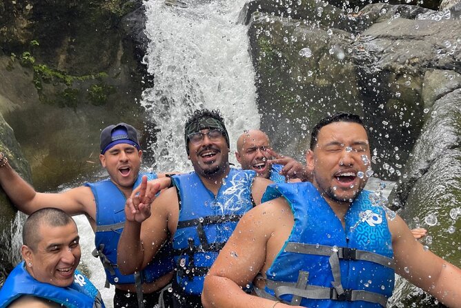 El Yunque Rainforest River and Beach Adventure Tour - Entering El Yunque by river, rock, and waterfall