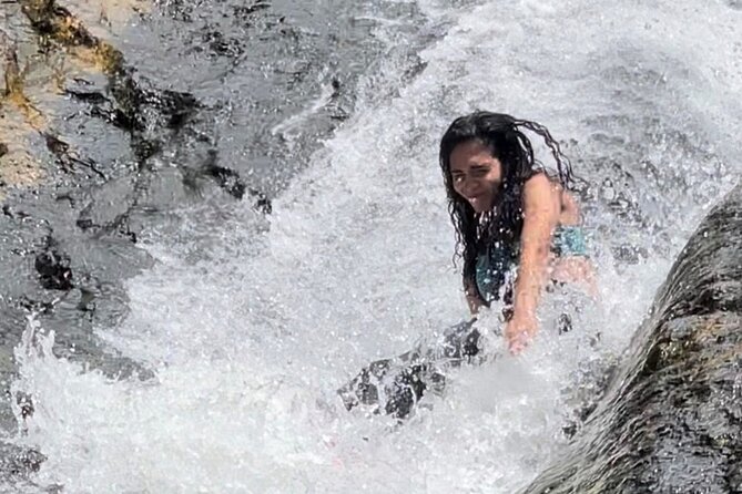 El Yunque Rainforest, Waterslides & Beach Tour from San Juan - Hiking through bamboo and rainforest flowers