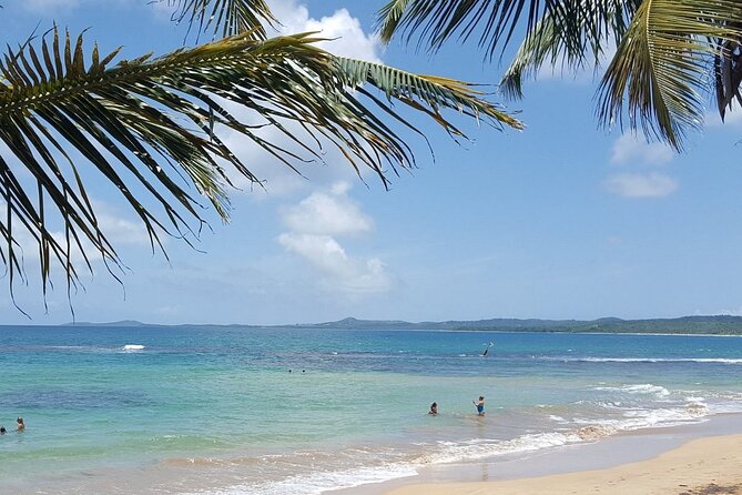 Private El Yunque Waterslides and Luquillo Beach Tour - Luquillo Beach, kiosks, and a Puerto Rican lunch