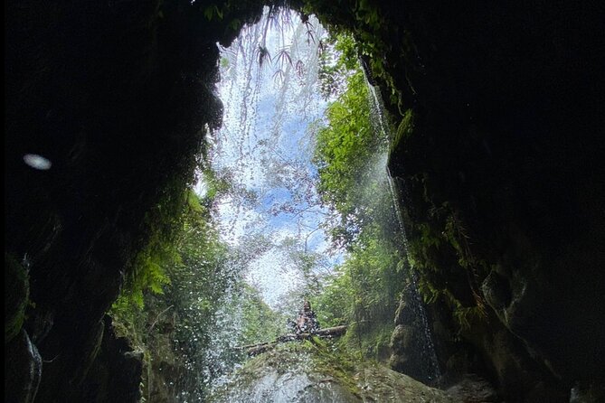 Rainforest Caves and Waterfalls Exploration with Transportation - Petroglyphs and the sense of place