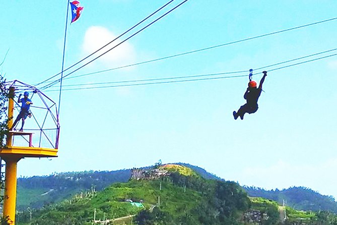 Rainforest Zipline, Luquillo Beach, and Natural Springs Day Trip - Ziplining above the El Yunque rainforest