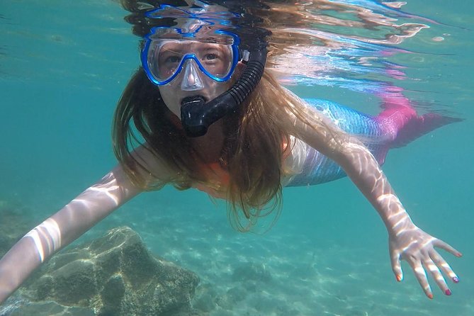 San Juan Mermaid Snorkel Experience with Video Shoot - Learning the mermaid poses at Escambron Beach